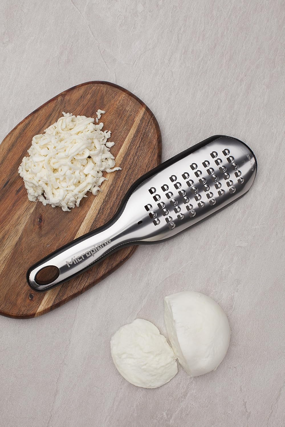 Microplane Elite Series Extra Coarse Grater - 18/8 Stainless Steel Blade, Photo-Etched Blade Technology, Soft-Grip Handle, Non-Slip Base, Dual-Purpose Cover and Measuring Cup - Black image number 6