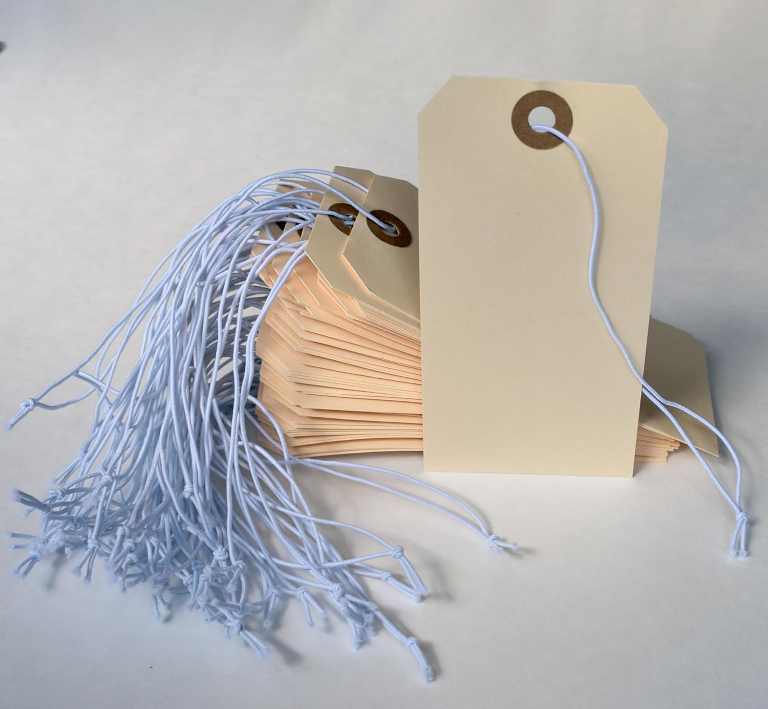 Tags with Elastic String Attached - #5, 4 3/4" X 2 3/8" Box of 200 Manila Paper Label Tags with Elastic Loop and Reinforced Hole image number 2