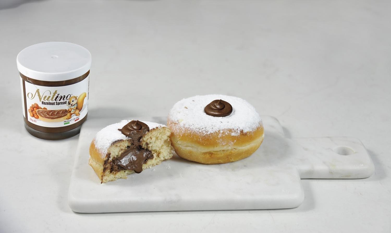 Nutino Premium Italian Chocolate Hazelnut Spread. No Artificial Colours or Preservatives. Perfect for Toast, Pizza, Ice Cream, Cakes, Croissants, Sandwiches, Milk and Fruit - 220G image number 6